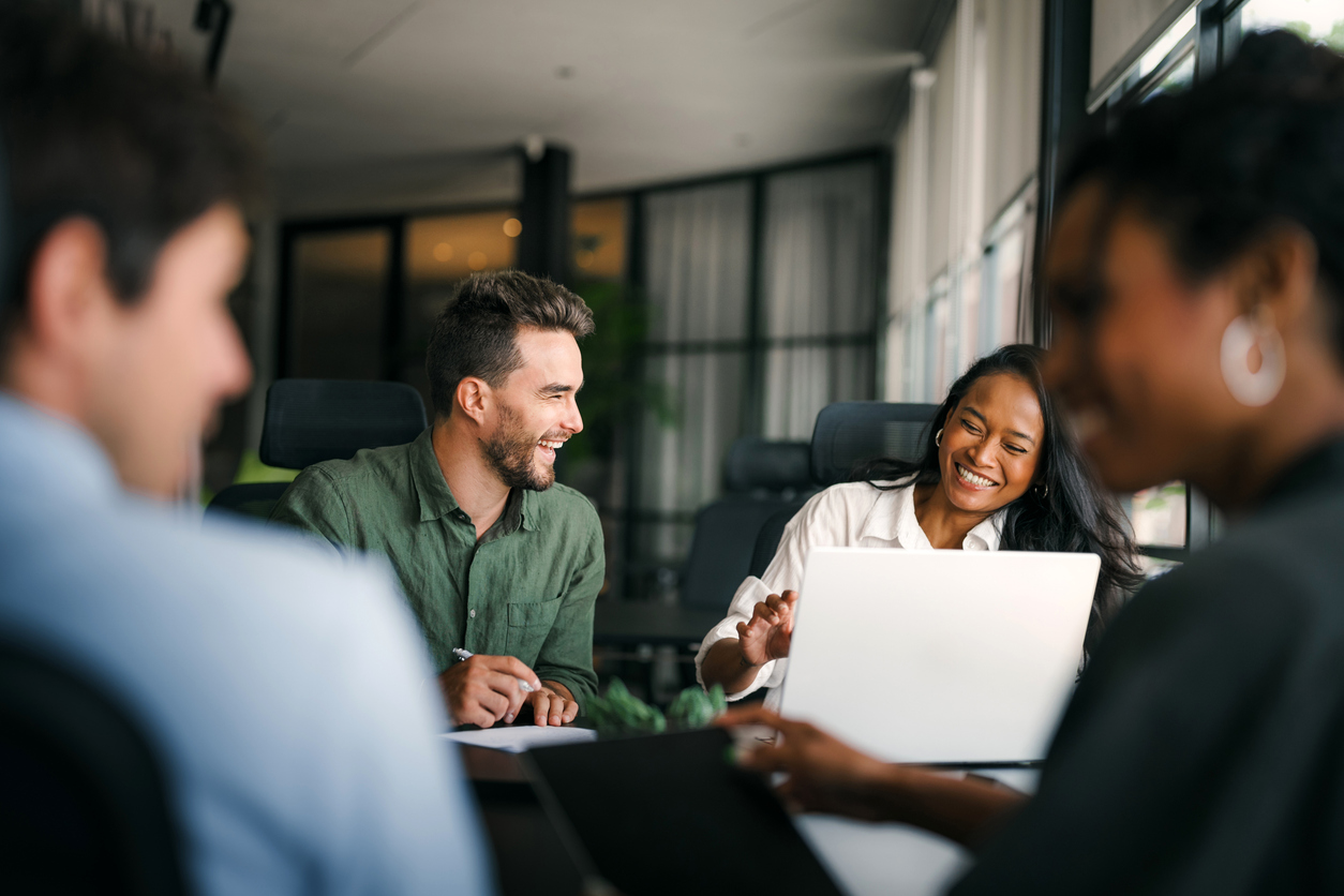 Group of young startup business team collaborating on project in modern office